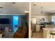 Open-concept living room with seamless flow to the kitchen and a comfortable seating arrangement at 1602 Taylor Lake Cir, Largo, FL 33778