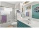 Bright bathroom with a shower-tub combo and vanity, offering a clean aesthetic at 1609 Pebble Beach N Blvd, Sun City Center, FL 33573