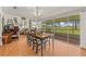 Dining area with wood floors and large glass doors offering scenic outdoor views at 1609 Pebble Beach N Blvd, Sun City Center, FL 33573