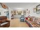 Cozy living room with tile flooring and built-in shelving, perfect for displaying cherished items at 1609 Pebble Beach N Blvd, Sun City Center, FL 33573