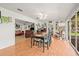 Open-concept room with tile floors seamlessly connecting living and dining spaces at 1609 Pebble Beach N Blvd, Sun City Center, FL 33573