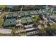 Aerial photo showcasing the community's multiple well-maintained tennis courts at 1609 Pebble Beach N Blvd, Sun City Center, FL 33573