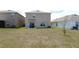 Spacious backyard of home showcasing ample space and lush lawn at 16728 Kingman Reef St, Wimauma, FL 33598