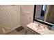 Bathroom featuring a single sink vanity, shower with patterned curtain, and ample space at 16728 Kingman Reef St, Wimauma, FL 33598