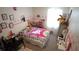 Bright and playful bedroom with colorful Hello Kitty bedding and custom wall decor at 16728 Kingman Reef St, Wimauma, FL 33598
