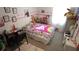 Bright and playful bedroom with colorful Hello Kitty bedding and custom wall decor at 16728 Kingman Reef St, Wimauma, FL 33598