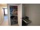 Spacious closet featuring ample shelving filled with games, storage containers and a keyboard on the side at 16728 Kingman Reef St, Wimauma, FL 33598