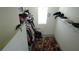 This walk-in closet features ample storage, a window for natural light and a stylish, colorful rug at 16728 Kingman Reef St, Wimauma, FL 33598