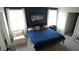 Serene primary bedroom boasts modern furnishings, neutral tones, and abundant natural light from dual windows at 16728 Kingman Reef St, Wimauma, FL 33598