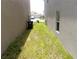 A side yard of the home showcasing the proximity to neighboring property at 16728 Kingman Reef St, Wimauma, FL 33598