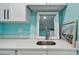 Modern bathroom featuring quartz countertops and a sleek sink with modern faucet at 1675 Eden Ct, Clearwater, FL 33756