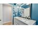 Elegant bathroom featuring double vanity, quartz countertops, and modern fixtures with stylish decor at 1675 Eden Ct, Clearwater, FL 33756