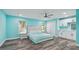 Spacious bedroom features an ensuite bathroom, a walk-in closet, and ample natural light at 1675 Eden Ct, Clearwater, FL 33756