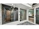 Stylish rock courtyard showing the exterior view of the bathroom and bedroom via sliding glass door at 1675 Eden Ct, Clearwater, FL 33756