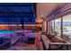 A lovely covered patio that includes ample seating and a swimming pool nearby at 1675 Eden Ct, Clearwater, FL 33756
