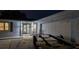 A garage and door well-lit at night, next to a trailer at 1675 Eden Ct, Clearwater, FL 33756