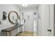 Neat foyer with laminate flooring, a white door, and wall decor at 1675 Eden Ct, Clearwater, FL 33756
