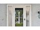 A front door with glass panels to let the natural light in at 1675 Eden Ct, Clearwater, FL 33756