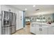 Open kitchen design with modern appliances and eat-in area leading to the outdoor space at 1675 Eden Ct, Clearwater, FL 33756