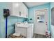 Convenient laundry room with appliances and storage, enhancing home functionality at 1675 Eden Ct, Clearwater, FL 33756
