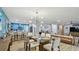 Open-concept living area connecting the dining room, kitchen, and living spaces at 1675 Eden Ct, Clearwater, FL 33756