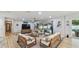 Spacious living room with modern furniture and a view of the outdoor pool through sliding glass doors at 1675 Eden Ct, Clearwater, FL 33756