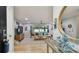 Bright, stylish living room with modern decor and access to an outdoor pool area at 1675 Eden Ct, Clearwater, FL 33756