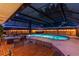 Inviting screened-in pool area with in-ground pool, hot tub, and patio space at 1675 Eden Ct, Clearwater, FL 33756