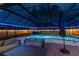 Inviting screened-in pool area with an in-ground pool, hot tub and stylish seating at 1675 Eden Ct, Clearwater, FL 33756