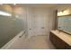 Modern bathroom with a glass shower, double vanity, and ample storage at 18033 Foxtail Loop, Venice, FL 34293