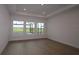 Bedroom with three large windows that provide natural light and views of the outside at 18033 Foxtail Loop, Venice, FL 34293