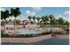 Resort-style community pool with ample seating and lush landscaping, ideal for relaxation and recreation at 18033 Foxtail Loop, Venice, FL 34293