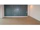 Living room with a decorative blue wall, wood floors, and plenty of space for entertaining at 18033 Foxtail Loop, Venice, FL 34293