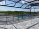 A lovely screened pool offers a secure enclosure with scenic backyard views at 18033 Foxtail Loop, Venice, FL 34293