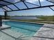 Relaxing pool with a screened lanai and a beautiful view of the community lake at 18033 Foxtail Loop, Venice, FL 34293