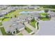 Aerial view featuring a neighborhood with a lake and well-manicured lawns at 1821 Cherry Walk Rd, Lutz, FL 33558