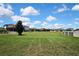 Large backyard featuring well-maintained lawn with lush green grass at 1821 Cherry Walk Rd, Lutz, FL 33558