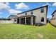 Expansive backyard with a covered patio, offering a relaxing outdoor space at 1821 Cherry Walk Rd, Lutz, FL 33558