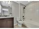 Bathroom showing a vanity, tub/shower combo, and neutral wall color at 1821 Cherry Walk Rd, Lutz, FL 33558