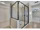 Bathroom features a glass shower, tiled walls, and neutral color palette at 1821 Cherry Walk Rd, Lutz, FL 33558