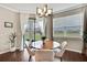 Cozy dining area features hardwood floors, natural light, and backyard view at 1821 Cherry Walk Rd, Lutz, FL 33558