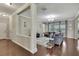 Inviting living room with stylish decor, hardwood floors, and large windows with bright light at 1821 Cherry Walk Rd, Lutz, FL 33558