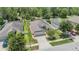 Aerial view of a single-Gathering home with well-manicured landscaping, a screened pool, and a two-car garage at 18343 Waydale Loop, Hudson, FL 34667