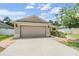 Charming single-story home with a well-maintained lawn and a two-car garage at 18343 Waydale Loop, Hudson, FL 34667