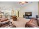 Spacious living room with a media center, comfortable seating, and easy access to the kitchen at 18343 Waydale Loop, Hudson, FL 34667