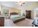 Bright main bedroom with a cozy bed, dresser, and ample closet space at 18343 Waydale Loop, Hudson, FL 34667