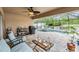 Screened lanai featuring a seating area, barbeque, and a swimming pool, perfect for outdoor enjoyment at 18343 Waydale Loop, Hudson, FL 34667