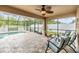 Relaxing screened lanai with comfortable seating and a view of the inviting swimming pool at 18343 Waydale Loop, Hudson, FL 34667