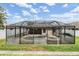A screened-in pool area with ample space for relaxation and entertainment at 18343 Waydale Loop, Hudson, FL 34667