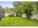 Well-manicured backyard with a shed and lush greenery, providing a private and serene outdoor space at 204 S Trask St, Tampa, FL 33609